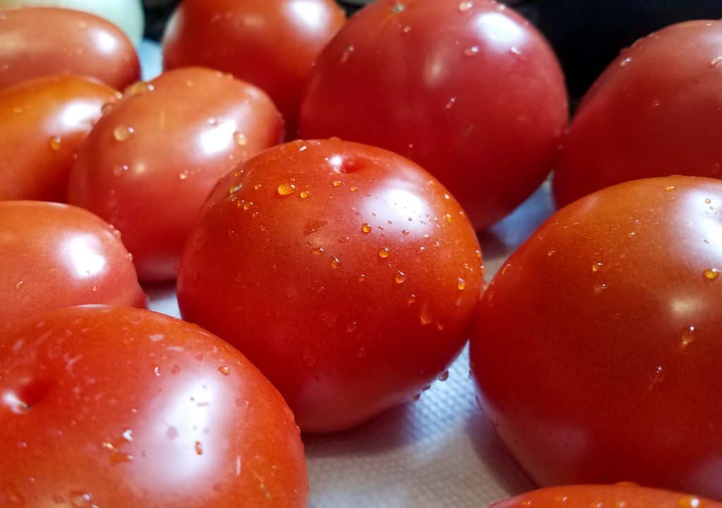 Juicy tomatoes, waiting to be prepped to make tomato bisque.