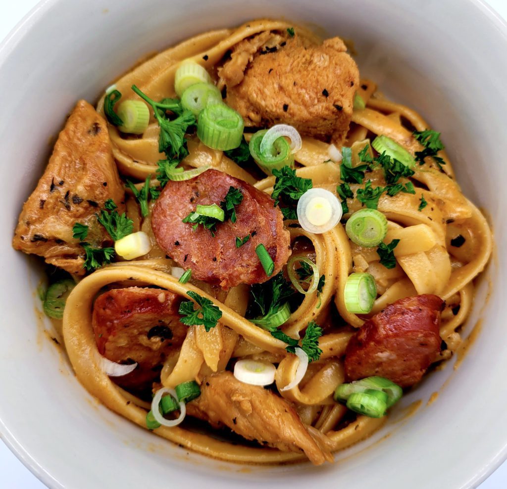 Overhead view of creamy Cajun chicken pasta with andouille sausage.